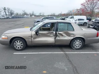 2003 Mercury Grand Marquis LS Premium z VIN 2MEFM75W73X653224, wystawiony jako IAAI lot #42038256 z przebiegiem 145 374 mil mil oraz . Historia ofert i sprzedaży dostępna na DreamBid. Obrazek 14.