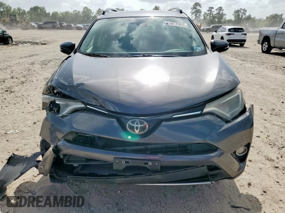 2018 Toyota RAV4 XLE with VIN 2T3WFREV2JW409292, listed as a Copart auction lot 61577355 with 189,258 mi miles and Salvage title. Bid and sale history available at DreamBid. Image 5.