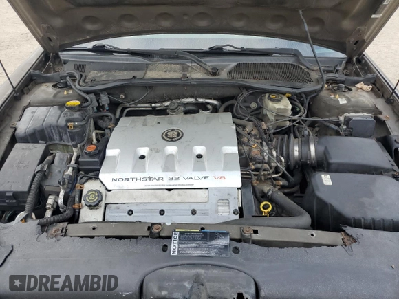 2000 Cadillac DeVille DTS z VIN 1G6KF5794YU249059, wystawiony jako Copart lot #71614494 z przebiegiem 121 611 mil mil oraz Szkoda całkowita • Salvage title. Historia ofert i sprzedaży dostępna na DreamBid. Obrazek 11.