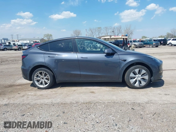 2022 Tesla Model Y Long Range with VIN 7SAYGDEE3NA007737, listed as a IAAI auction lot 42128359 with 42,597 mi miles and . Bid and sale history available at carsss.com. Image 14.