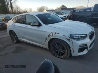2019 BMW X4 M40i with VIN 5UXUJ5C55KLJ64105, listed as a Copart auction lot 87162014 with 92,946 mi miles and Salvage title. Bid and sale history available at DreamBid. Image 4.