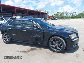 2014 Chrysler 300 C with VIN 2C3CCAKT9EH171614, listed as a IAAI auction lot 39747704 with 129,156 mi miles and . Bid and sale history available at carsss.com. Image 6.