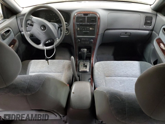 2005 Kia Optima LX z VIN KNAGD128155423463, wystawiony jako Copart lot #87441284 z przebiegiem 143 193 mil mil oraz Szkoda całkowita • Salvage title. Historia ofert i sprzedaży dostępna na DreamBid. Obrazek 8.