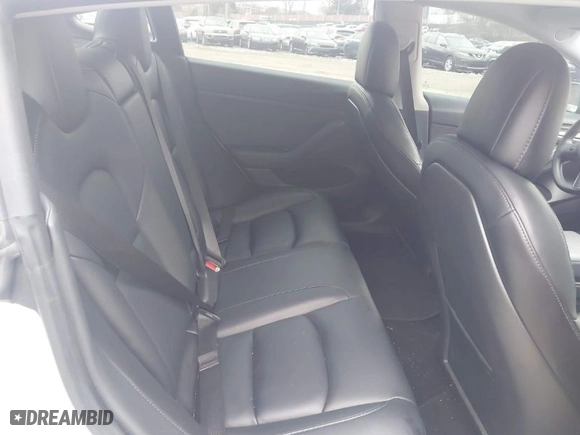 2021 Tesla Model 3 Performance with VIN 5YJ3E1EC5MF059625, listed as a IAAI auction lot 41652748 with 63,287 mi miles. Bid and sale history available at carsss.com. Image 8.