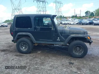 2004 Jeep Wrangler Sport z VIN 1J4FA49S94P792689, wystawiony jako IAAI lot #42394196 z przebiegiem Nie podano mil oraz . Historia ofert i sprzedaży dostępna na DreamBid. Obrazek 14.