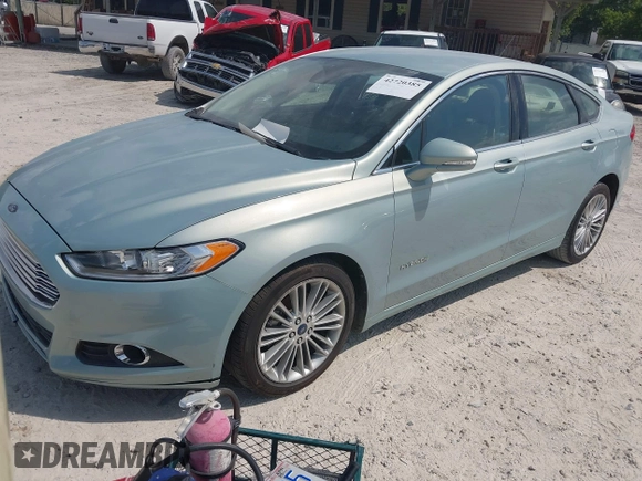 2013 Ford Fusion SE Hybrid z VIN 3FA6P0LU8DR265460, wystawiony jako IAAI lot #42720385 z przebiegiem 146 179 mil mil oraz . Historia ofert i sprzedaży dostępna na DreamBid. Obrazek 2.