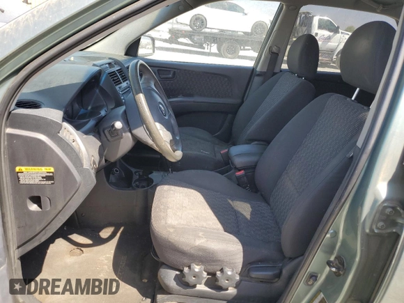 2006 Kia Sportage LX z VIN KNDJF724X67282904, wystawiony jako Copart lot #69264114 z przebiegiem 231 772 mil mil oraz Czysty tytuł • Clean title. Historia ofert i sprzedaży dostępna na DreamBid. Obrazek 7.