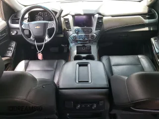 2019 Chevrolet Suburban LT with VIN 1GNSCHKCXKR207233, listed as a Copart auction lot 55410464 with 107,500 mi miles and Salvage Title. Bid and sale history available at DreamBid. Image 8.