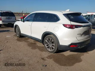 2016 Mazda CX-9 Grand Touring z VIN JM3TCADY6G0125547, wystawiony jako IAAI lot #41997445 z przebiegiem 129 179 mil mil oraz . Historia ofert i sprzedaży dostępna na DreamBid. Obrazek 3.