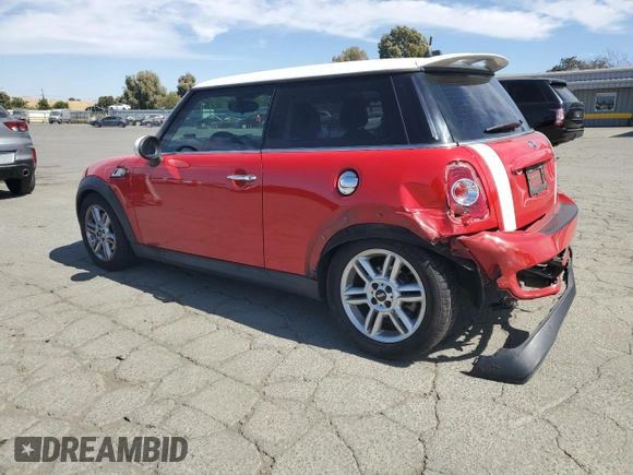 2011 MINI Hardtop S with VIN WMWSV3C50BTY12562, listed as a Copart auction lot 61183425 with 125,126 mi miles and Salvage title. Bid and sale history available at DreamBid. Image 2.