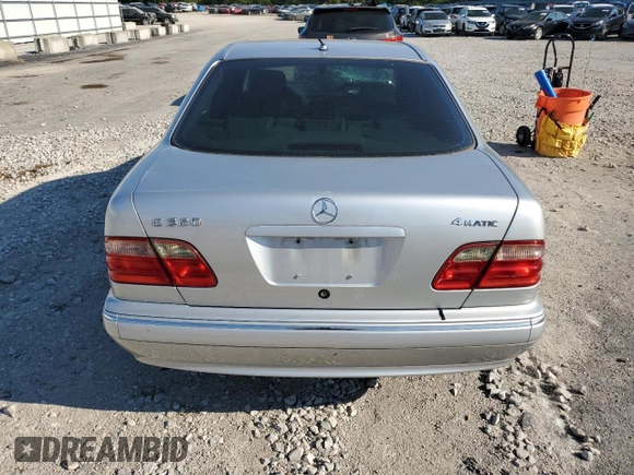 2002 Mercedes-Benz E-Class with VIN WDBJF82J42X077731, listed as a Copart auction lot 70280584 with 169,018 mi miles and Salvage Title. Bid and sale history available at carsss.com. Image 6.