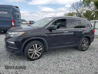 2017 Honda Pilot Touring with VIN 5FNYF6H9XHB075468, listed as a Copart auction lot 50012215 with 90,718 mi miles and Salvage Title. Bid and sale history available at carsss.com. Image 1.