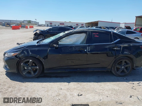 2022 Nissan Sentra SR z VIN 3N1AB8DV0NY313438, wystawiony jako IAAI lot #42076992 z przebiegiem Nie podano mil oraz . Historia ofert i sprzedaży dostępna na DreamBid. Obrazek 14.