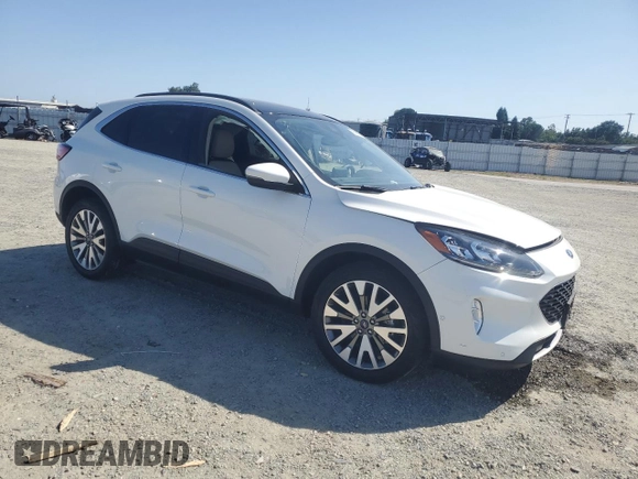 2020 Ford Escape Titanium Hybrid z VIN 1FMCU9DZ6LUC47658, wystawiony jako Copart lot #59599995 z przebiegiem 63 004 mil mil oraz Szkoda całkowita • Salvage title. Historia ofert i sprzedaży dostępna na DreamBid. Obrazek 4.