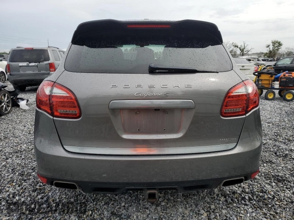 2011 Porsche Cayenne S with VIN WP1AB2A2XBLA55565, listed as a Copart auction lot 63094305 with 105,250 mi miles and Salvage title. Bid and sale history available at DreamBid. Image 6.