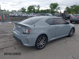 2014 Scion tC z VIN JTKJF5C71E3081033, wystawiony jako IAAI lot #42333111 z przebiegiem 144 124 mil mil oraz . Historia ofert i sprzedaży dostępna na DreamBid. Obrazek 4.