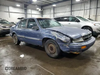 1991 Dodge Spirit z VIN 1B3XA46K9MF628235, wystawiony jako Copart lot #83581274 z przebiegiem 117 774 mil mil oraz Szkody całkowita. Historia ofert i sprzedaży dostępna na DreamBid. Obrazek 4.