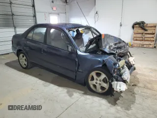 2000 Mazda Protege ES with VIN JM1BJ221XY0211385, listed as a Copart auction lot 48225605 with Not Provided miles and Non Repairable. Bid and sale history available at DreamBid. Image 4.
