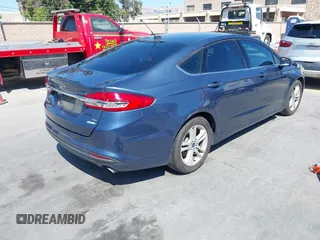 2018 Ford Fusion SE with VIN 3FA6P0HD4JR161780, listed as a IAAI auction lot 42527140 with 89,419 mi miles and . Bid and sale history available at DreamBid. Image 4.