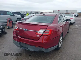 2015 Ford Taurus SEL with VIN 1FAHP2E8XFG137526, listed as a IAAI auction lot 41909658 with 147,992 mi miles and . Bid and sale history available at carsss.com. Image 4.