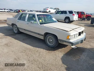 1991 Mercury Grand Marquis z VIN 2MECM75F7MX637786, wystawiony jako IAAI lot #41429297 z przebiegiem 12 512 mil mil oraz . Historia ofert i sprzedaży dostępna na DreamBid. Obrazek 1.