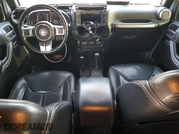 2015 Jeep Wrangler Unlimited Rubicon Hard Rock with VIN 1C4HJWFGXFL671660, listed as a Copart auction lot 82329074 with 214,579 mi miles and Salvage title. Bid and sale history available at DreamBid. Image 8.