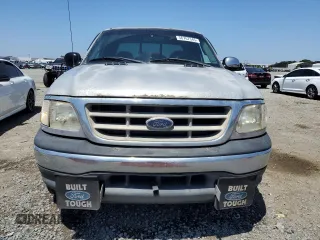 2001 Ford F-150 XL with VIN 1FTRX17W11NA24623, listed as a Copart auction lot 56767345 with 201,959 mi miles and Salvage title. Bid and sale history available at DreamBid. Image 5.