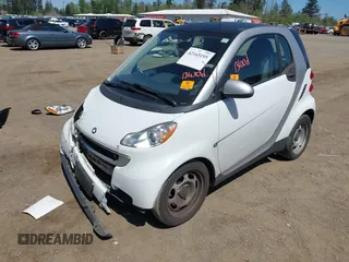 2012 Smart fortwo Pure z VIN WMEEJ3BAXCK563660, wystawiony jako IAAI lot #42165195 z przebiegiem 53 809 mil mil oraz . Historia ofert i sprzedaży dostępna na DreamBid. Obrazek 2.