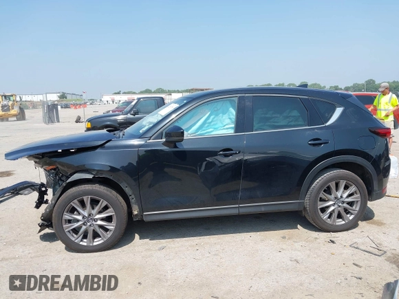 2020 Mazda CX-5 Grand Touring with VIN JM3KFADM1L0781634, listed as a IAAI auction lot 42333769 with 103,080 mi miles and . Bid and sale history available at DreamBid. Image 14.