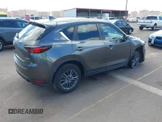 2021 Mazda CX-5 Touring with VIN JM3KFACM2M1348305, listed as a IAAI auction lot 41627199 with 30,044 mi miles. Bid and sale history available at carsss.com. Image 4.