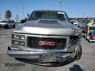 1999 GMC Yukon with VIN 1GKEC13R9XJ704929, listed as a Copart auction lot 89097295 with 87,478 mi miles and Salvage Title. Bid and sale history available at carsss.com. Image 5.