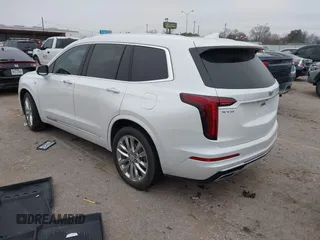 2021 Cadillac XT6 Premium Luxury z VIN 1GYKPCRSXMZ169206, wystawiony jako IAAI lot #41581841 z przebiegiem 64 789 mil mil oraz . Historia ofert i sprzedaży dostępna na DreamBid. Obrazek 3.