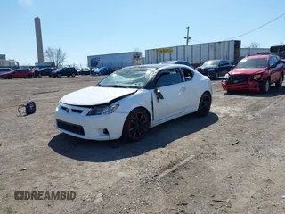 2012 Scion tC with VIN JTKJF5C7XC3029980, listed as a IAAI auction lot 41832490 with 132,140 mi miles. Bid and sale history available at carsss.com. Image 2.