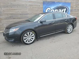 2014 Lincoln MKS EcoBoost z VIN 1LNHL9FT9EG607363, wystawiony jako Copart lot #87765345 z przebiegiem 121 615 mil mil oraz Czysty tytuł • Clean title. Historia ofert i sprzedaży dostępna na DreamBid. Obrazek 1.