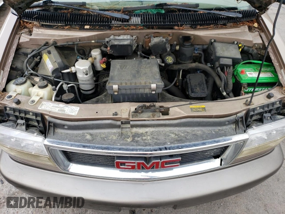 1999 GMC Safari z VIN 1GKEL19W4XB506220, wystawiony jako Copart lot #77257424 z przebiegiem 151 966 mil mil oraz Czysty tytuł • Clean title. Historia ofert i sprzedaży dostępna na DreamBid. Obrazek 12.