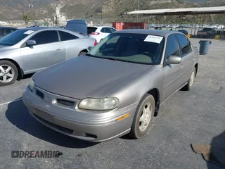1999 Oldsmobile Cutlass GL z VIN 1G3NB52M9X6313424, wystawiony jako IAAI lot #42345276 z przebiegiem 191 527 mil mil oraz . Historia ofert i sprzedaży dostępna na DreamBid. Obrazek 2.