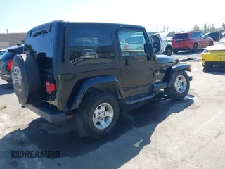 2001 Jeep Wrangler Sahara z VIN 1J4FA59S41P313113, wystawiony jako IAAI lot #42266173 z przebiegiem 125 792 mil mil oraz . Historia ofert i sprzedaży dostępna na DreamBid. Obrazek 4.