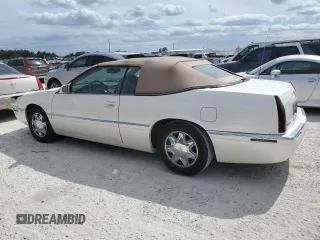2002 Cadillac Eldorado z VIN 1G6EL12Y32B102263, wystawiony jako Copart lot #77108634 z przebiegiem 43 162 mil mil oraz Nie do naprawy • Non repairable. Historia ofert i sprzedaży dostępna na DreamBid. Obrazek 2.