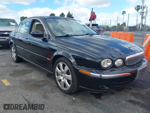 2004 Jaguar X-Type with VIN SAJEA51C44WD56659, listed as a IAAI auction lot 41712395 with Not Provided miles and . Bid and sale history available at DreamBid. Image 1.