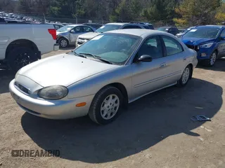 1999 Mercury Sable GS z VIN 1MEFM50U0XG609913, wystawiony jako IAAI lot #41783308 z przebiegiem 80 022 mil mil oraz . Historia ofert i sprzedaży dostępna na DreamBid. Obrazek 2.
