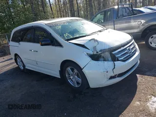 2012 Honda Odyssey Touring with VIN 5FNRL5H93CB146753, listed as a IAAI auction lot 41984850 with 155,309 mi miles and . Bid and sale history available at DreamBid. Image 1.