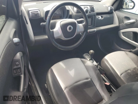 2009 Smart fortwo Passion z VIN WMEEK31X89K289001, wystawiony jako Copart lot #51781925 z przebiegiem 79 742 mil mil oraz Szkoda całkowita • Salvage title. Historia ofert i sprzedaży dostępna na DreamBid. Obrazek 8.