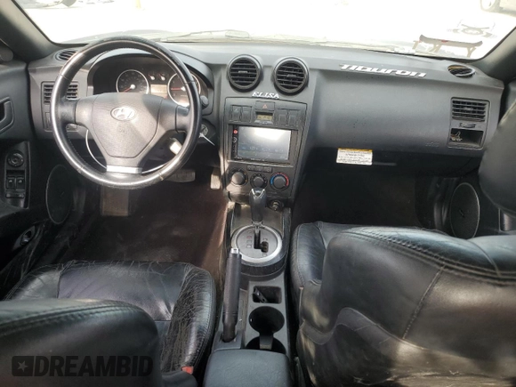 2003 Hyundai Tiburon GT z VIN KMHHN65F13U102985, wystawiony jako Copart lot #45294325 z przebiegiem 326 919 mil mil oraz Szkoda całkowita • Salvage title. Historia ofert i sprzedaży dostępna na DreamBid. Obrazek 8.