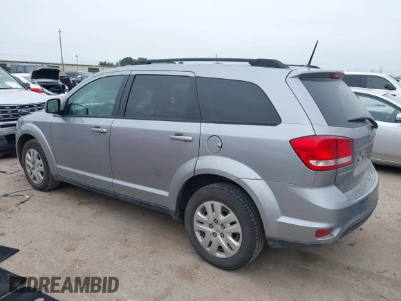 2019 Dodge Journey SE with VIN 3C4PDCBB0KT816103, listed as a IAAI auction lot 41640272 with 118,310 mi miles and . Bid and sale history available at DreamBid. Image 3.