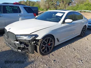 2023 BMW 5 Series M550i xDrive with VIN WBA13BK04PCL88909, listed as a IAAI auction lot 42045994 with 27,729 mi miles and . Bid and sale history available at DreamBid. Image 2.