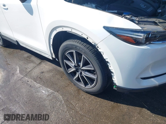 2018 Mazda CX-5 Grand Touring z VIN JM3KFBDM8J0420422, wystawiony jako IAAI lot #42188348 z przebiegiem 102 216 mil mil oraz . Historia ofert i sprzedaży dostępna na DreamBid. Obrazek 6.