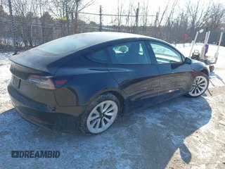 2022 Tesla Model 3 with VIN 5YJ3E1EA1NF304811, listed as a IAAI auction lot 41559342 with 29,597 mi miles and . Bid and sale history available at DreamBid. Image 4.