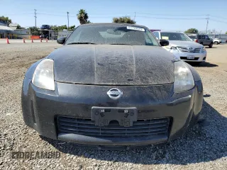 2004 Nissan 350Z Touring with VIN JN1AZ36A74T002301, listed as a Copart auction lot 61720524 with 101,779 mi miles and Salvage Title. Bid and sale history available at carsss.com. Image 5.