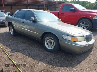 2000 Mercury Grand Marquis LS z VIN 2MEFM75W0YX626096, wystawiony jako IAAI lot #42361449 z przebiegiem 139 380 mil mil oraz . Historia ofert i sprzedaży dostępna na DreamBid. Obrazek 1.