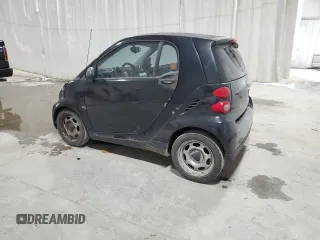 2011 Smart fortwo Pure с VIN WMEEJ3BA5BK480412, выставлен на аукционе Copart как лот 87023194 с пробегом 70 496 миль миль и Списание • Salvage title. История ставок и продаж доступна на DreamBid. Изображение 2.